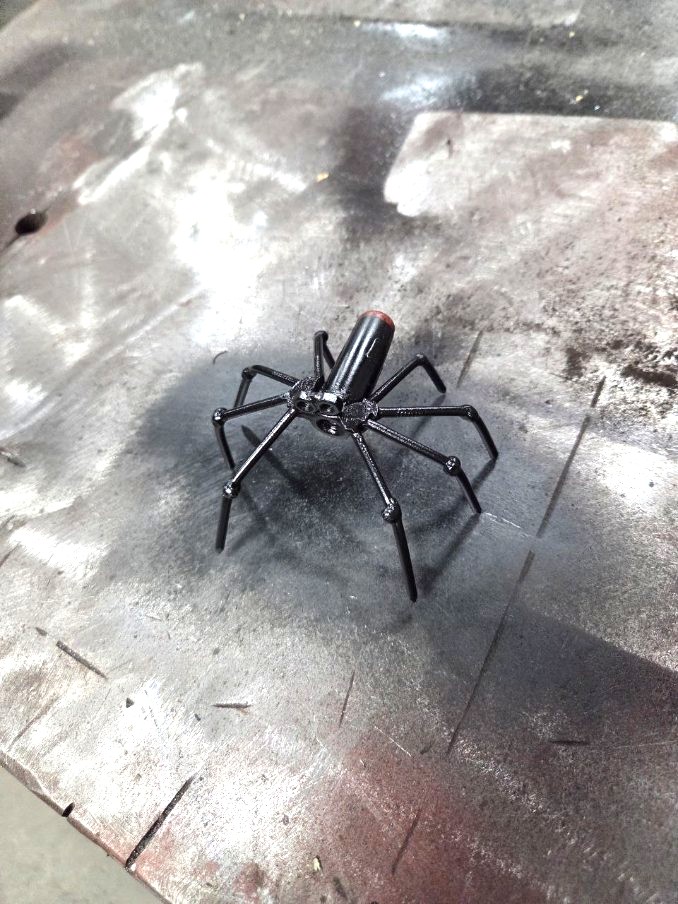 Welded steel spider sculpture made from hardware and rod stock
