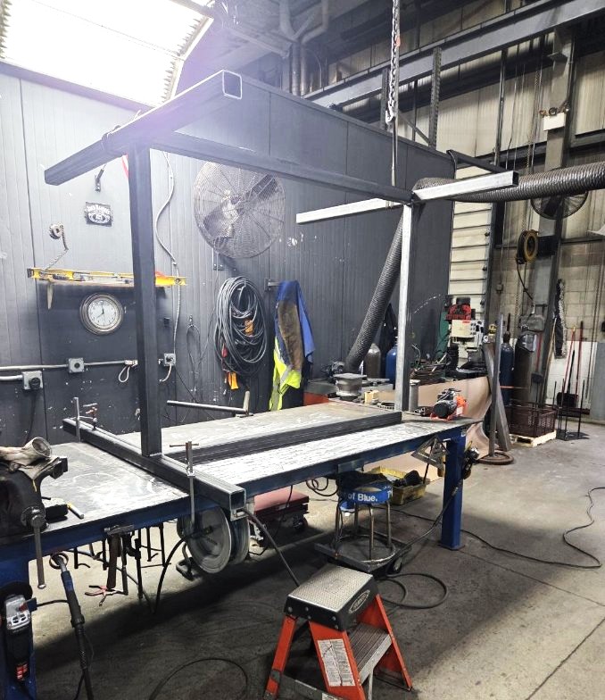 Heavy steel overhead frame and cart fabricated in the shop