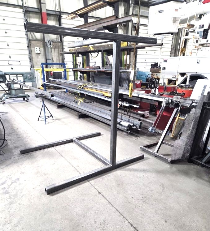 Fabricated steel square tubing stand with weighted T base