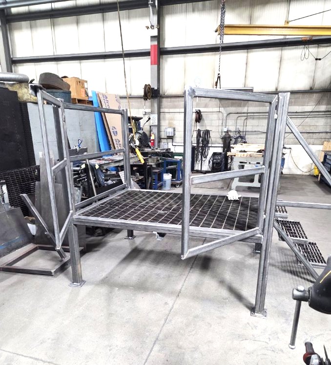 Welded steel platform frame with guardrails prior to paint