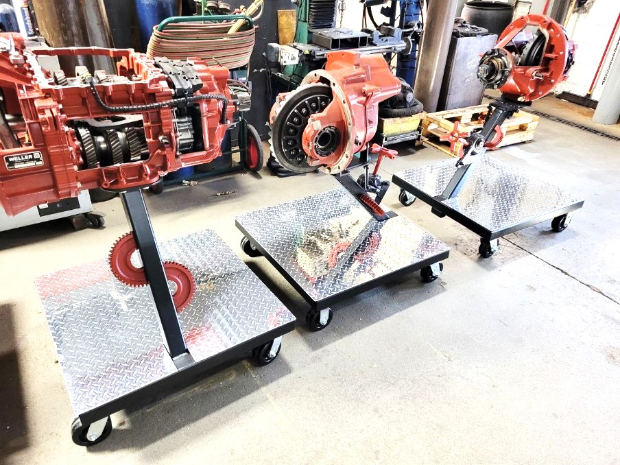Set of custom diamond plate rolling stands built for holding transmissions and differentials during rebuild work