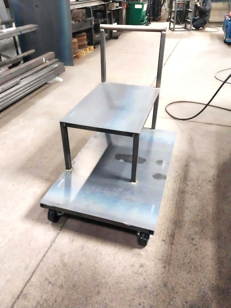 Two-tier steel shop cart with push handle and heavy-duty casters