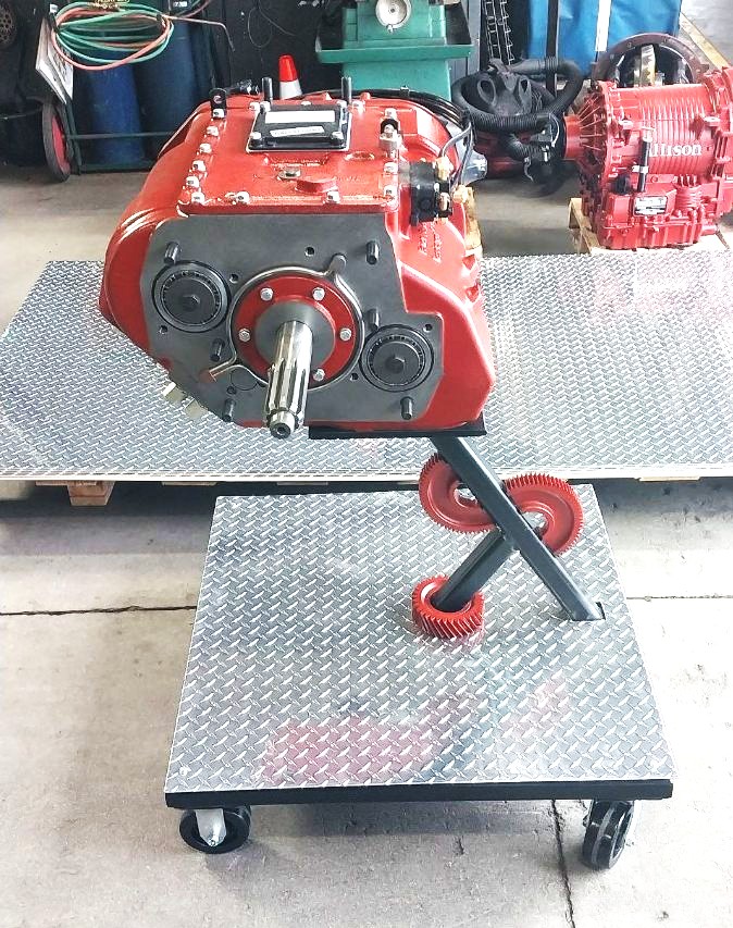 Custom transmission mounting cart with diamond plate deck and welded gear accents