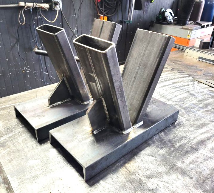 Welded steel tube and plate stands fabricated on the shop table
