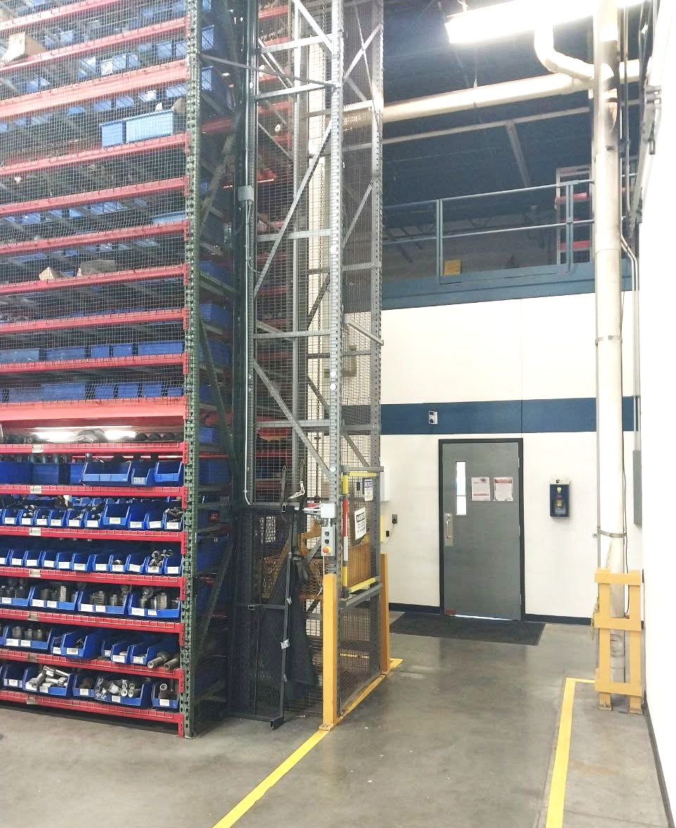 Industrial parts storage racking and safety guarding installed in a warehouse facility